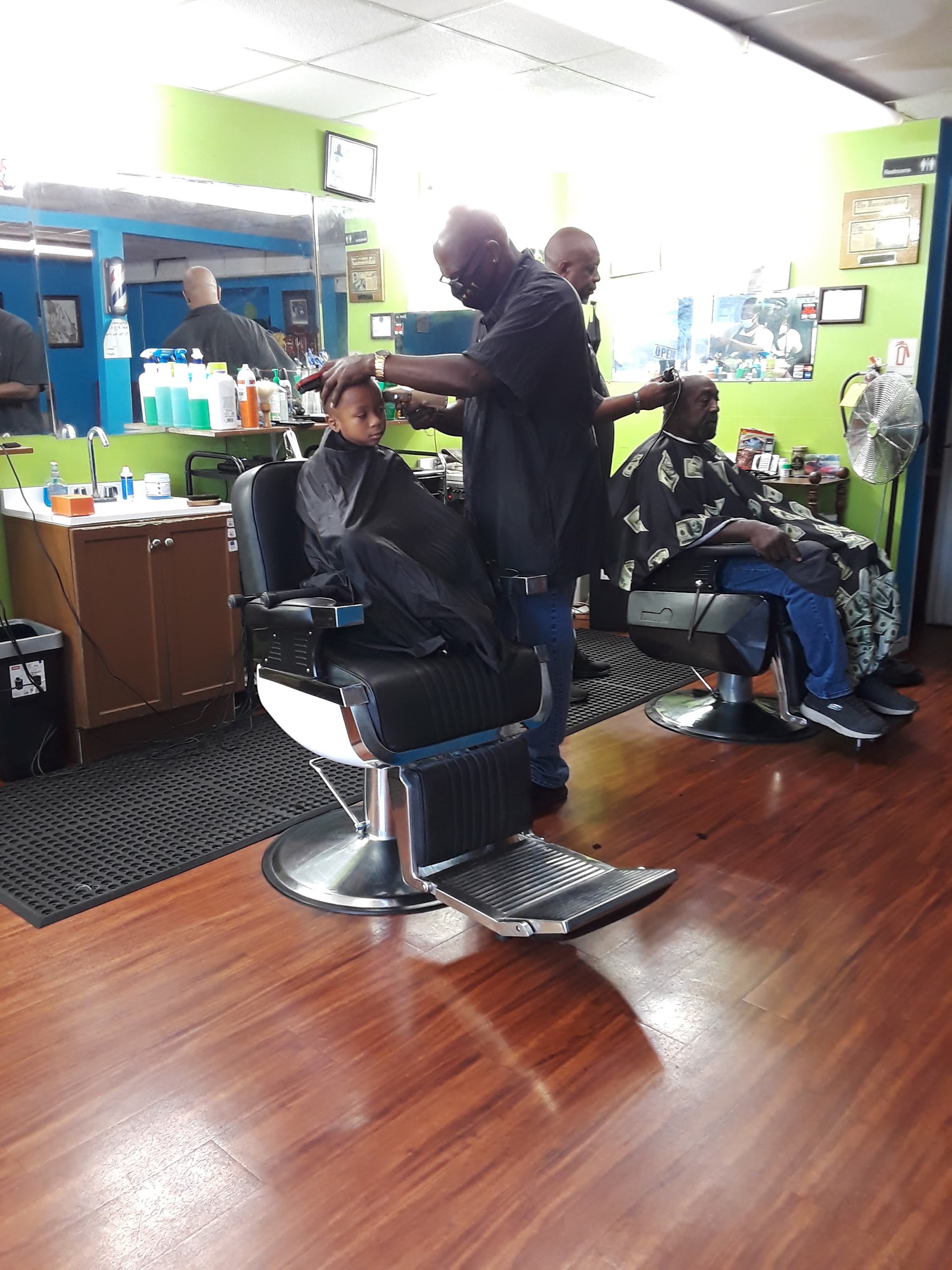 Our shop floor with barbers working at their chairs