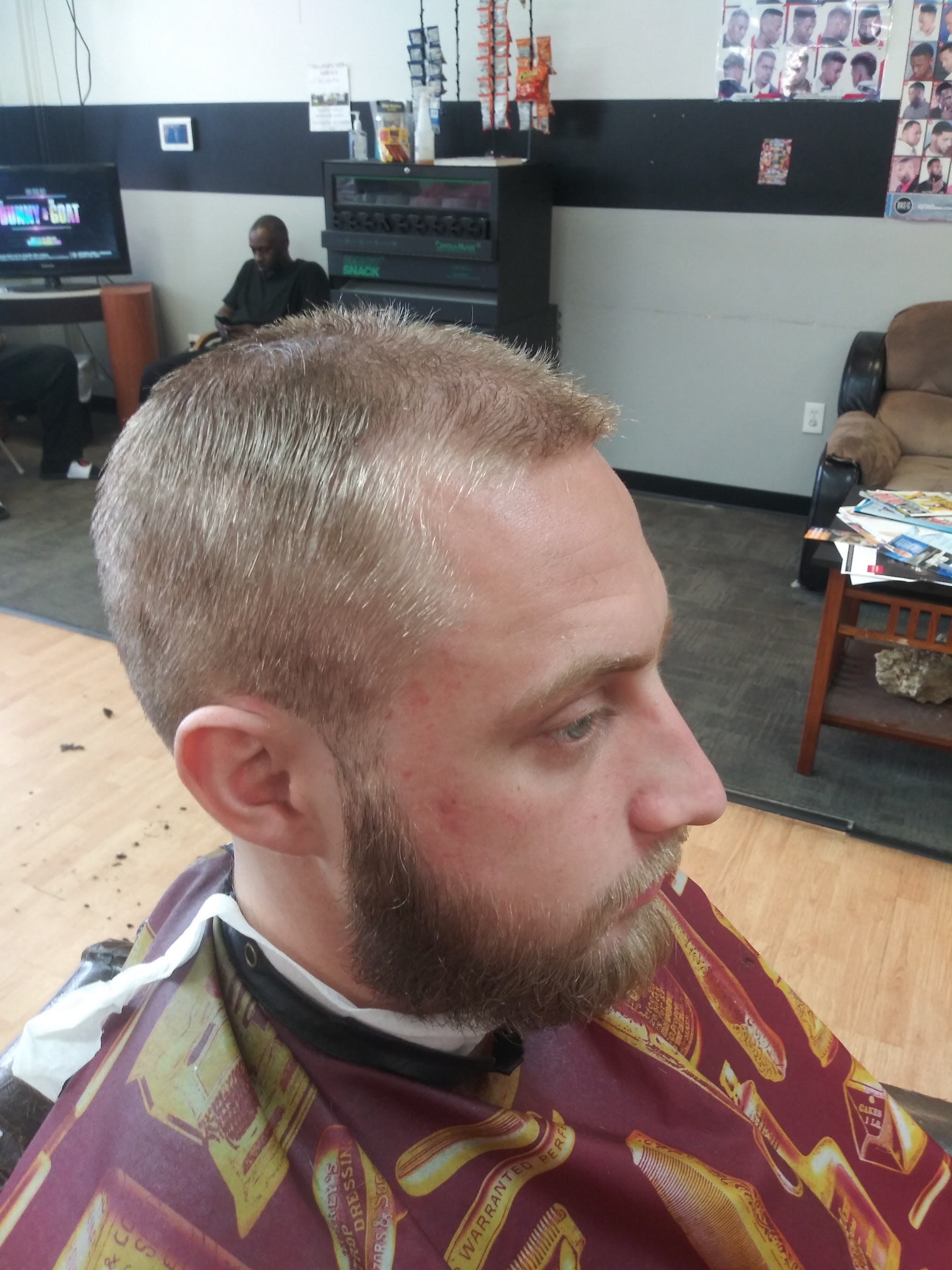A short, clean cut with a groomed beard
